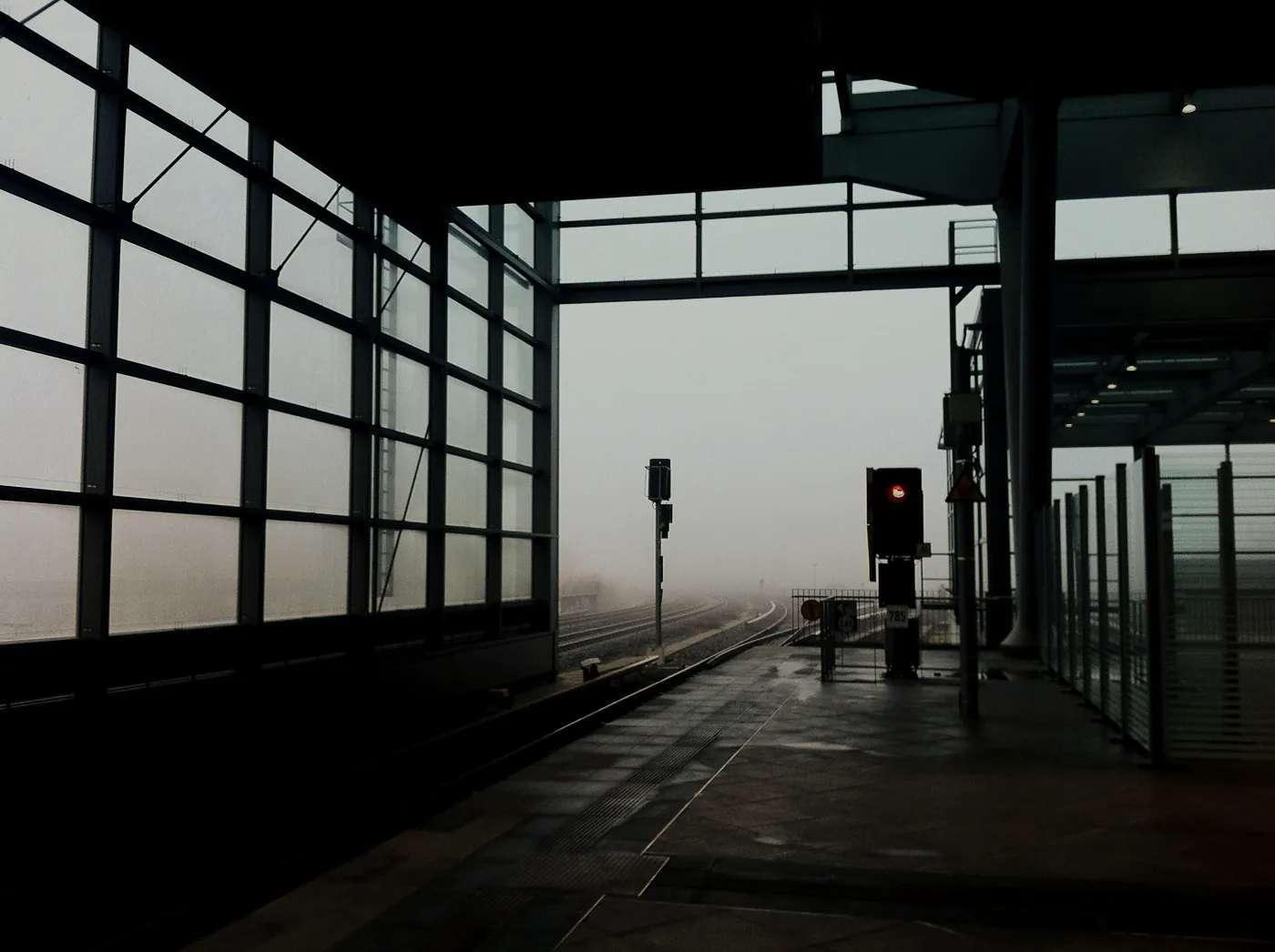 A platform in thick morning fog